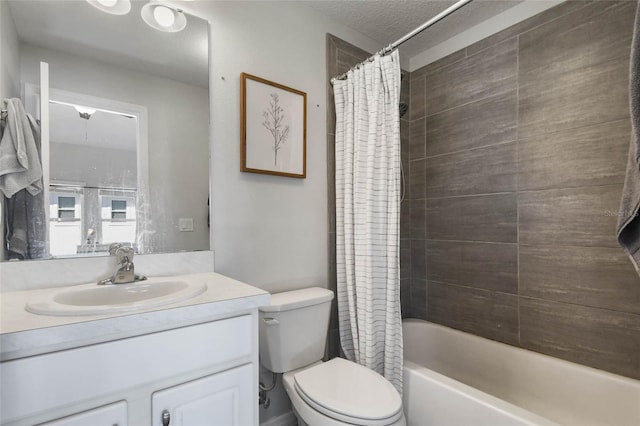 full bathroom with shower / bathtub combination with curtain, vanity, toilet, and a textured ceiling