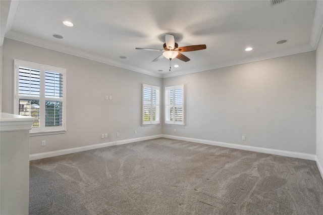 unfurnished room featuring ornamental molding, ceiling fan, and carpet