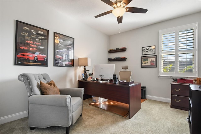 office area featuring light carpet and ceiling fan