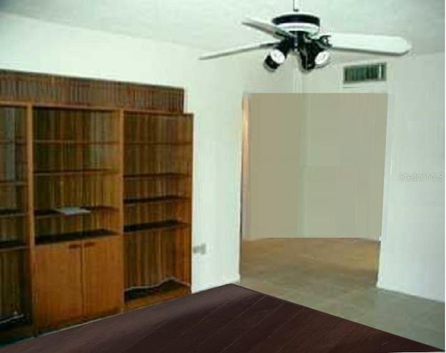 unfurnished room featuring ceiling fan