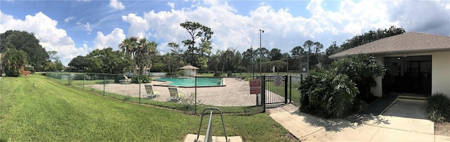 view of swimming pool featuring a lawn