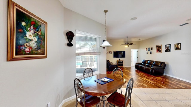 dining room featuring light tile patterned floors and ceiling fan