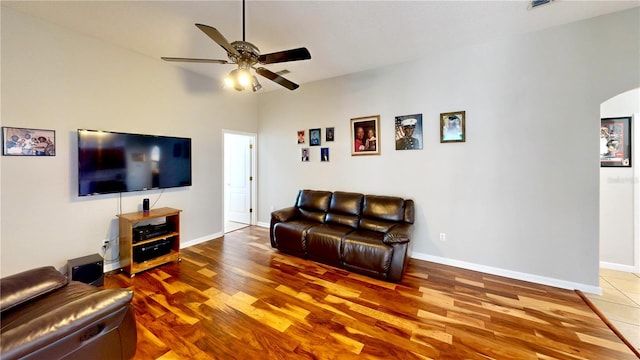 living room with hardwood / wood-style flooring and ceiling fan