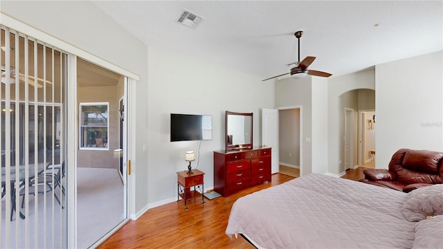 bedroom with lofted ceiling, access to outside, ceiling fan, and light hardwood / wood-style flooring