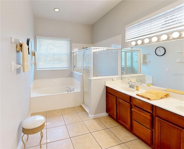 bathroom featuring tile patterned flooring, plus walk in shower, and vanity