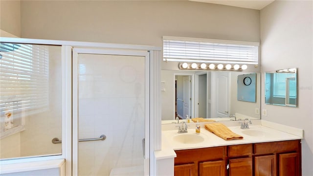 bathroom featuring vanity and a shower