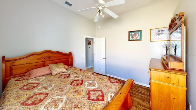 bedroom with hardwood / wood-style flooring, ceiling fan, and lofted ceiling