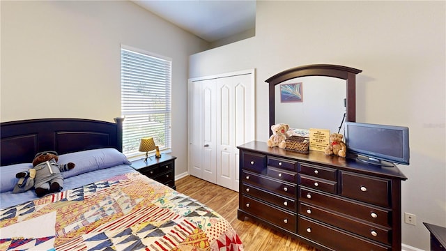 bedroom featuring a closet and light wood-type flooring