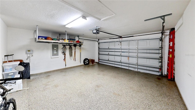 garage featuring a garage door opener and electric panel