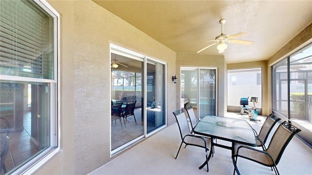 sunroom featuring plenty of natural light and ceiling fan