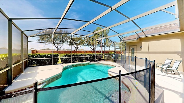 view of swimming pool with a lanai and a patio area