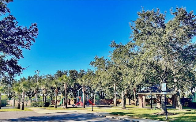 view of home's community featuring a playground