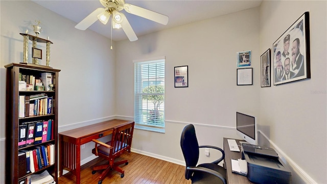 home office featuring hardwood / wood-style floors and ceiling fan