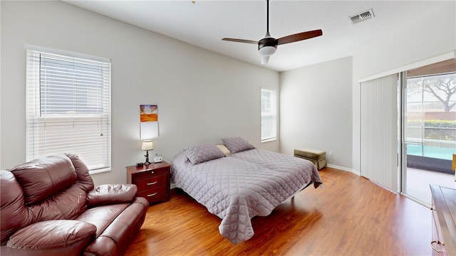 bedroom with access to outside, ceiling fan, and light wood-type flooring