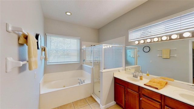 bathroom with vanity, shower with separate bathtub, and tile patterned flooring