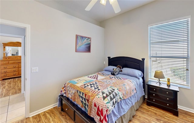 bedroom with ceiling fan and light wood-type flooring