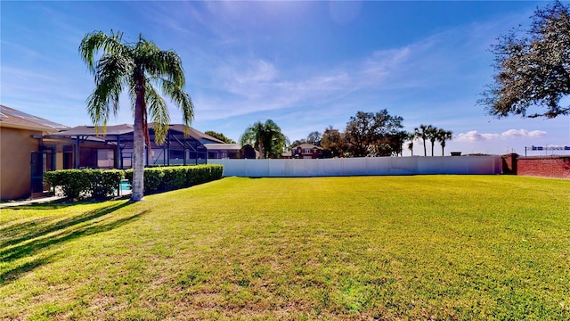 view of yard with a lanai