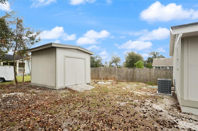 view of yard with a shed and central air condition unit