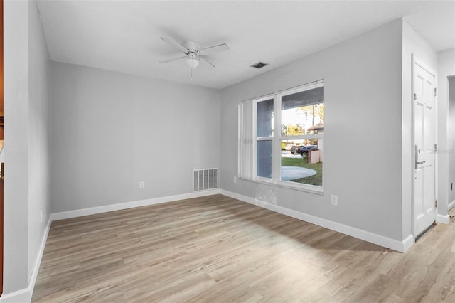 spare room featuring light hardwood / wood-style floors and ceiling fan