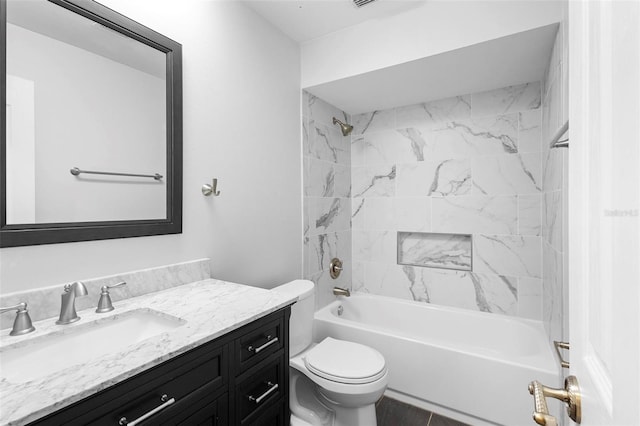 full bathroom featuring vanity, toilet, and tiled shower / bath