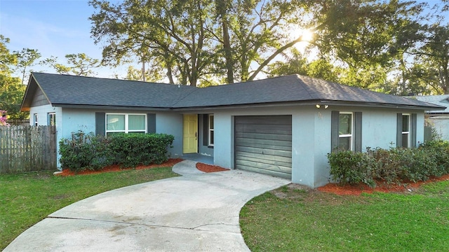 ranch-style home with a front yard and a garage