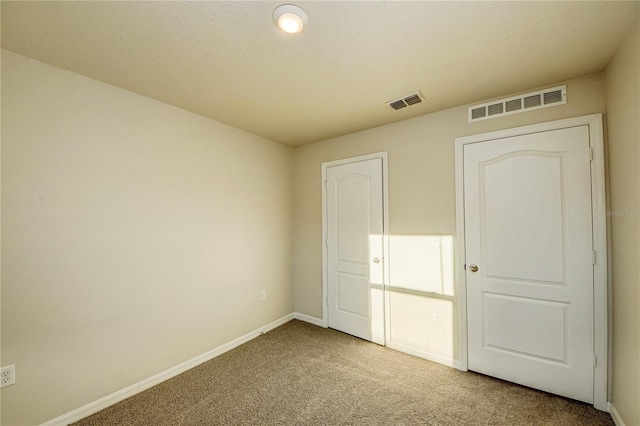 unfurnished bedroom featuring carpet floors