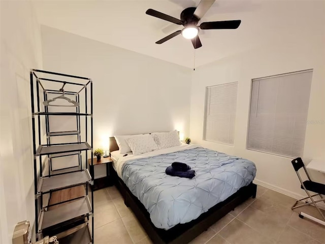 bedroom with tile patterned flooring and ceiling fan