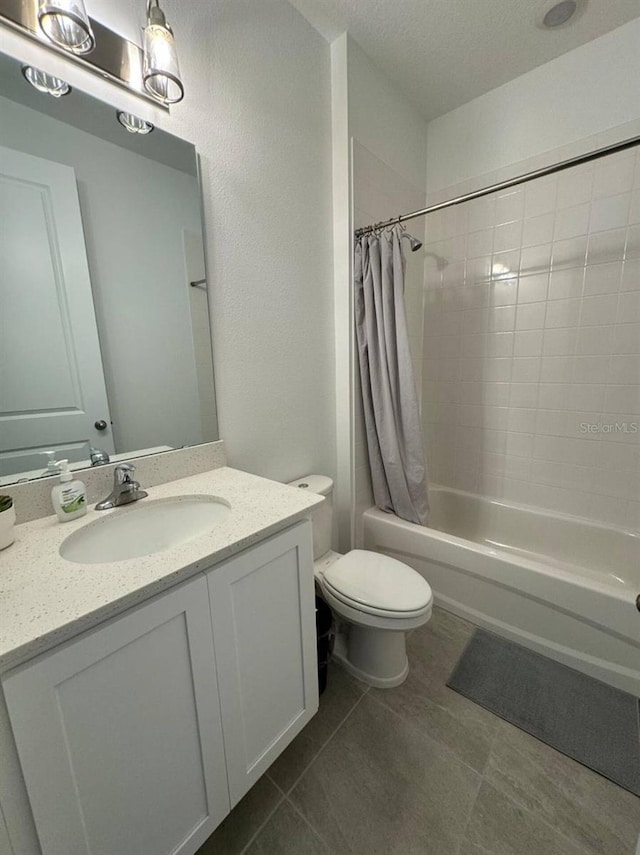 full bathroom with a textured ceiling, vanity, toilet, and shower / bathtub combination with curtain