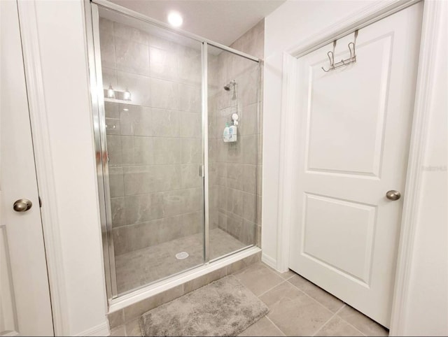 bathroom featuring tile patterned floors and walk in shower