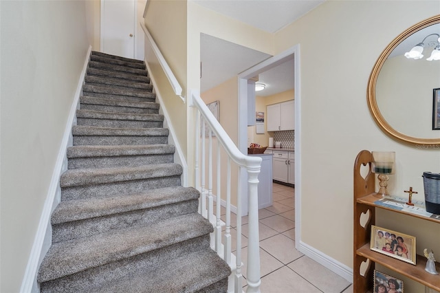 stairs featuring tile patterned flooring