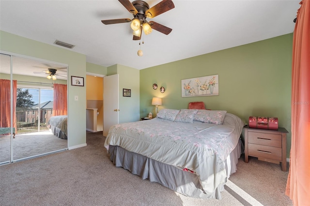 bedroom featuring access to exterior, ceiling fan, and light colored carpet