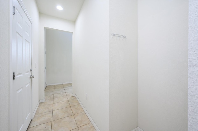 corridor with light tile patterned floors