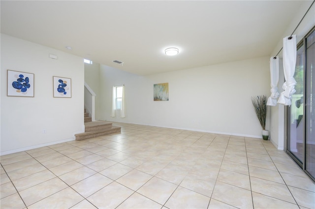 unfurnished room featuring light tile patterned flooring