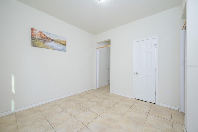 unfurnished bedroom with light tile patterned flooring