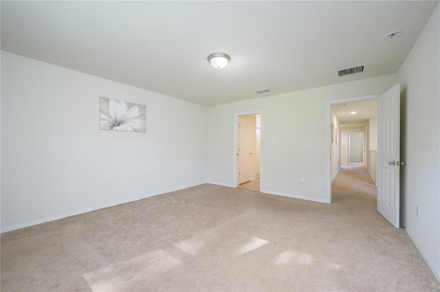 unfurnished bedroom featuring light carpet