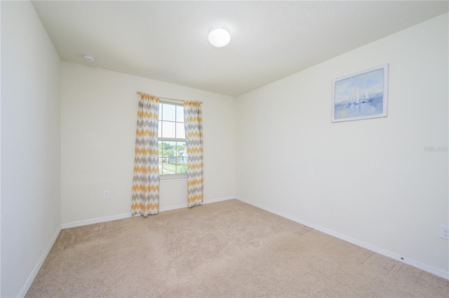 empty room with light colored carpet