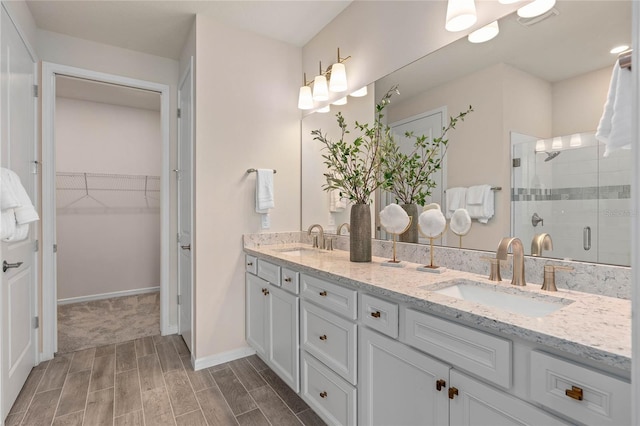 bathroom featuring vanity and an enclosed shower