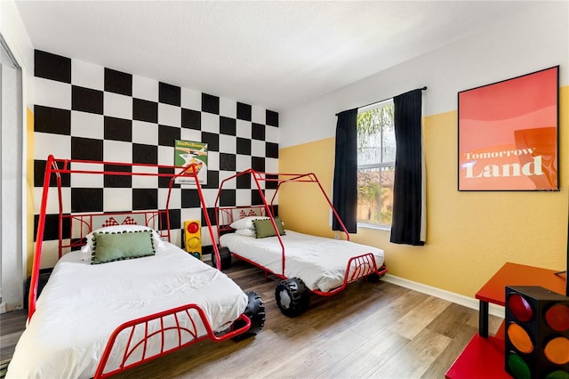 bedroom with hardwood / wood-style flooring