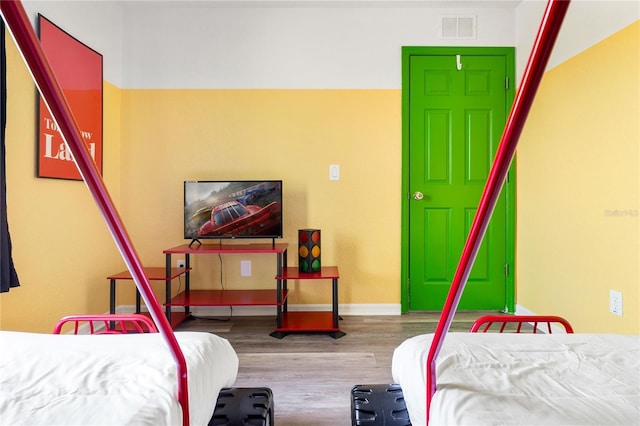 bedroom featuring hardwood / wood-style flooring