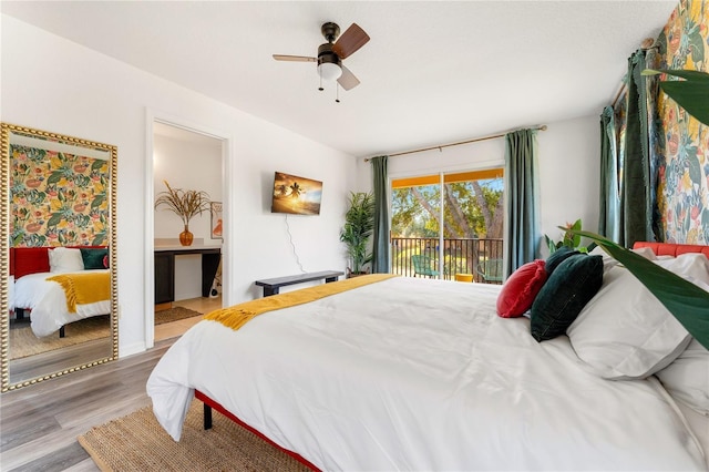 bedroom featuring hardwood / wood-style flooring, ceiling fan, and access to outside