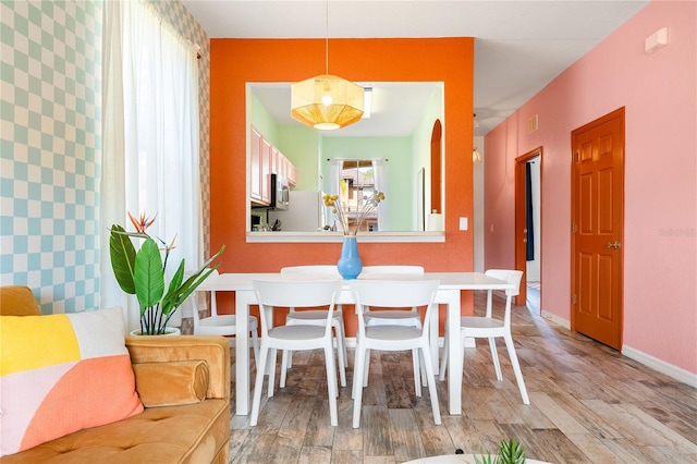 dining area featuring light wood-type flooring