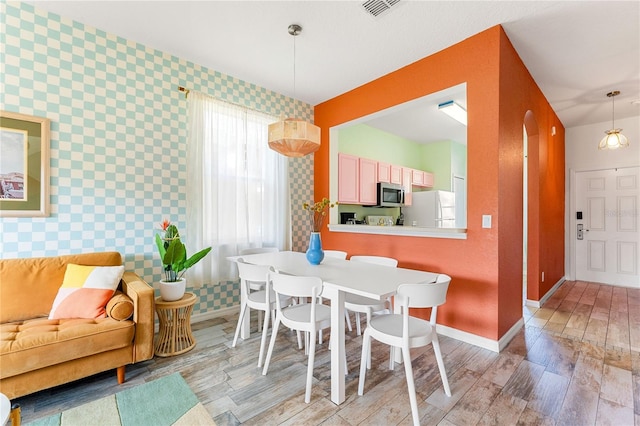 dining room with light hardwood / wood-style floors