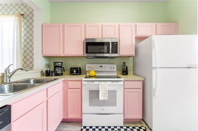 kitchen with white appliances and sink