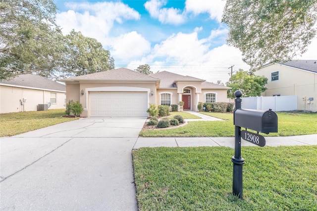 view of front of house with a garage and a front yard