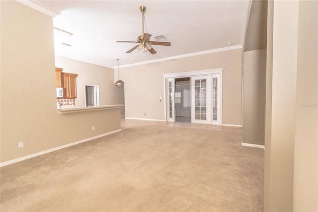 unfurnished living room featuring ceiling fan, crown molding, and light carpet