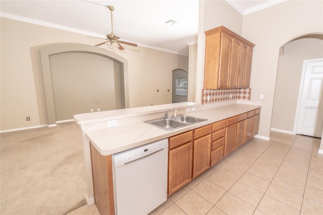 kitchen featuring dishwasher, ornamental molding, sink, and kitchen peninsula