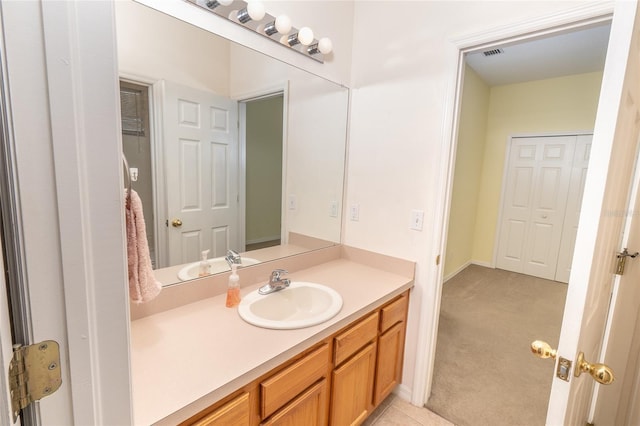 bathroom featuring tile patterned floors and vanity