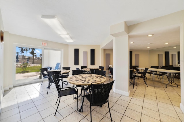 dining area featuring light tile patterned floors, baseboards, and recessed lighting