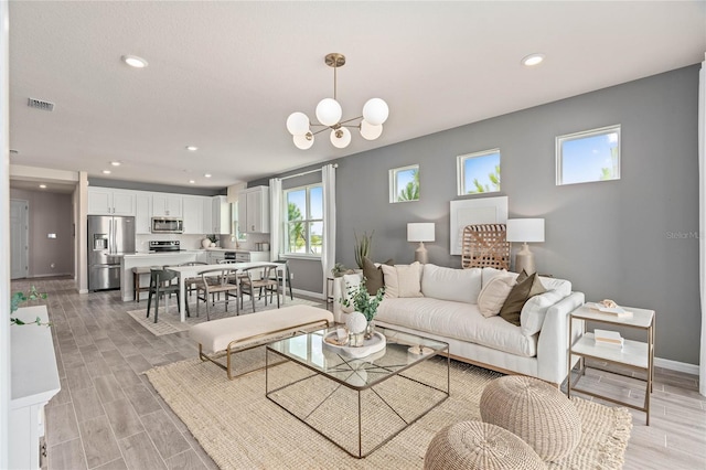 living room featuring an inviting chandelier