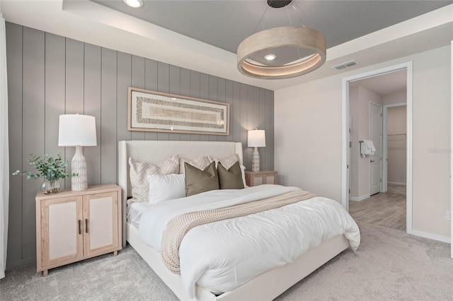 bedroom with a tray ceiling